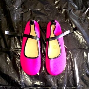 Bright pink flats with adjustable straps
